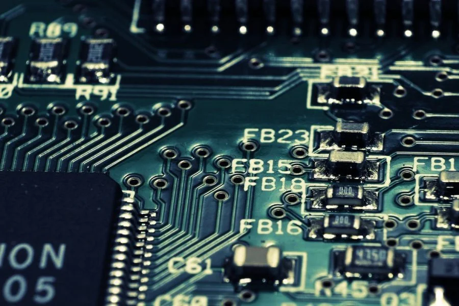 a close up of a computer motherboard with a circuit board